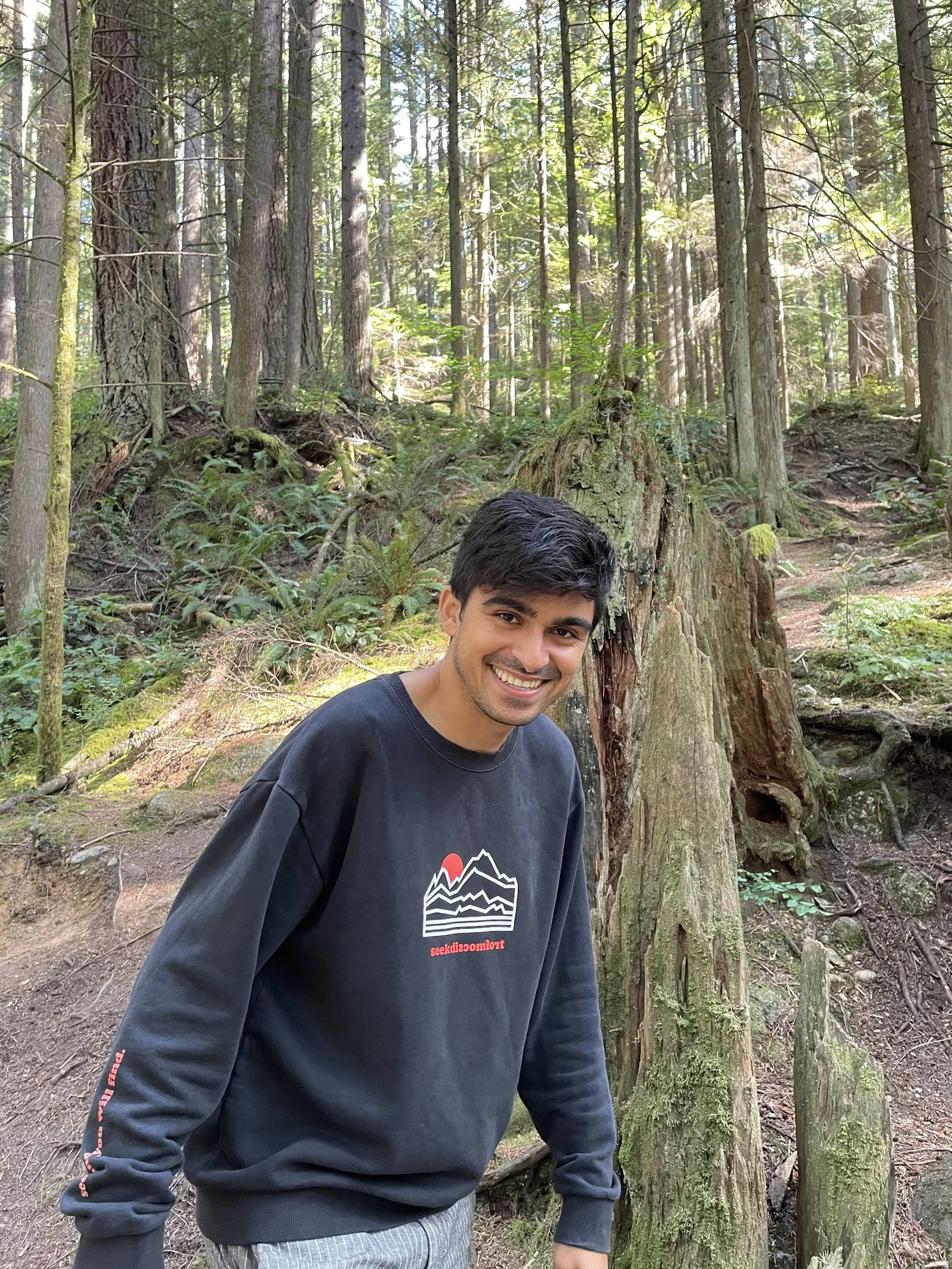 Portrait of Yasha Ektefaie in a forest
